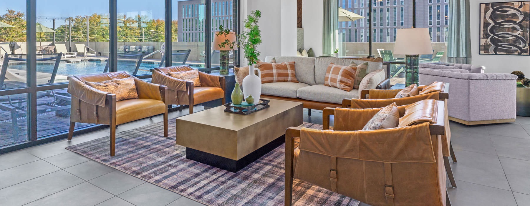 chairs, tables and couches in bright clubhouse