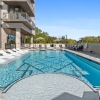 Resort-style swimming pool with lounge seating